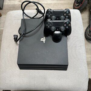 Sony PlayStation 4 Pro (PS4 Pro) Black Video Game Console with 2 Controllers
